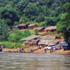 People wait on the Kasai bank to cross the river.