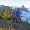 John Lyakurwa poses at Bondwa Peak while doing research in the Uluguru mountains, another massif within the Eastern Arc Mountains.