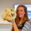Dickie holds a polar bear skull in Churchill, Manitoba, Canada.