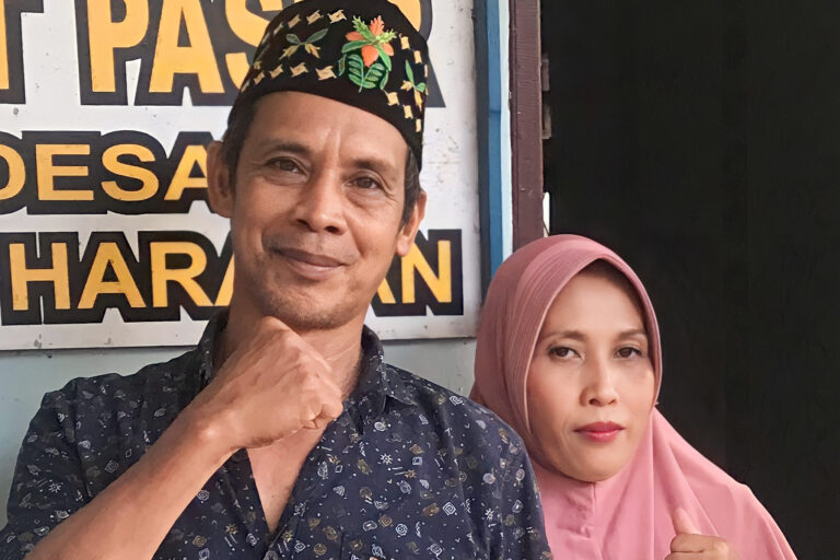 Syarak, the customary elder in Bumi Harapan, with his wife.